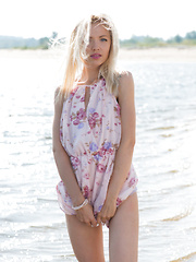 New model Camelia sensually strips at the beach as she bares her petite body.