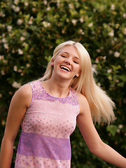 Shy white-haired girl relaxing on the backyard