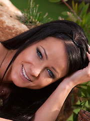 Carefree and uninhibited Melisa, lusty and passionately posing with a orange scarf on the vast, green landscape.