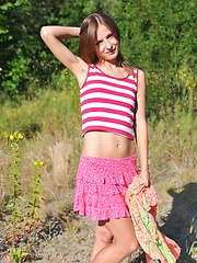 Lovely slender babe likes to pose naked on the sun in wild environment. Wilderness out as well inside is her best asset.