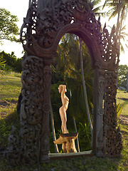 Naked girl photographer photographing her friend in the garden