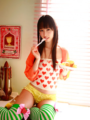 Rina Akiyama Asian in long colorful socks enjoys some sweets